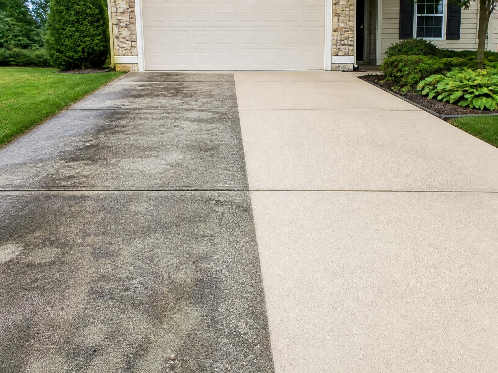 Driveway in Kent, WA shown half dirty and half cleaned by pressure washing